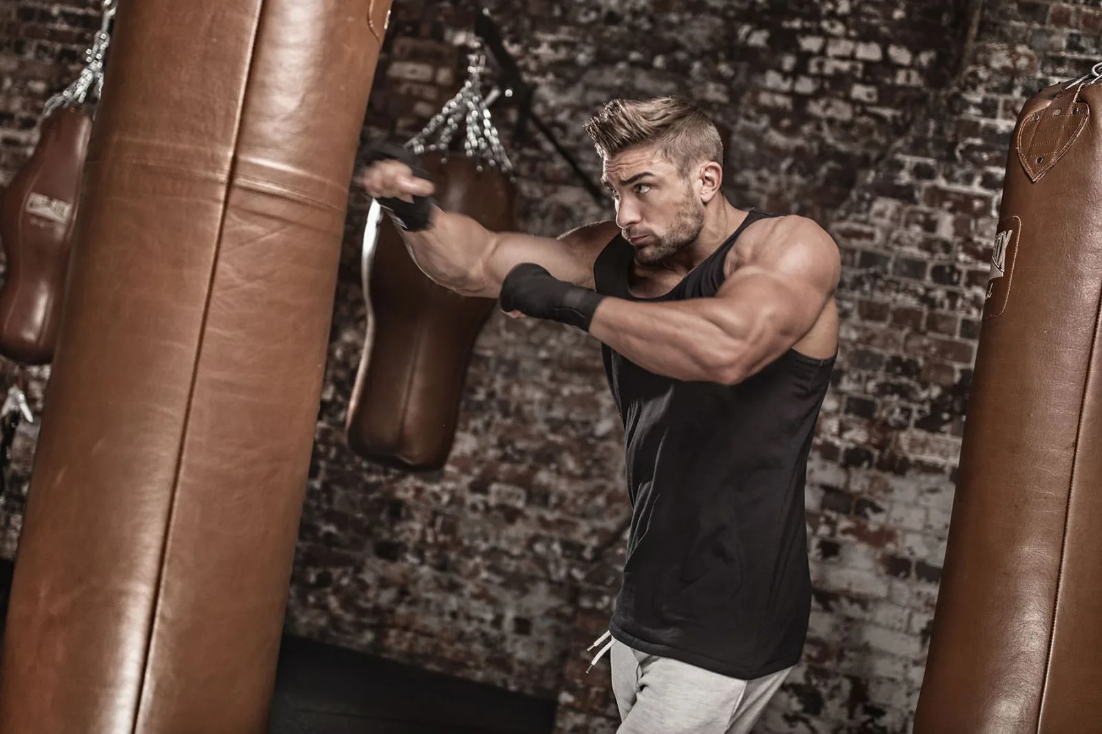 Editorial fitness photoshoot with dramatic studio lighting